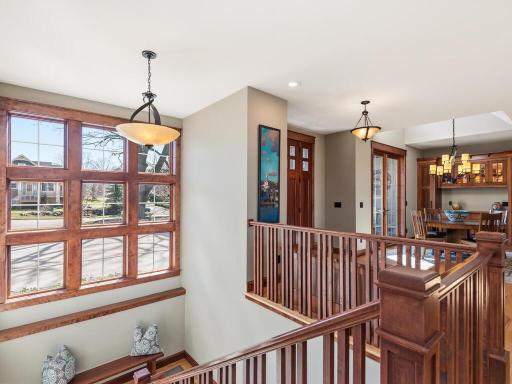Grand stairs to Lower Level with lots of nature light.
