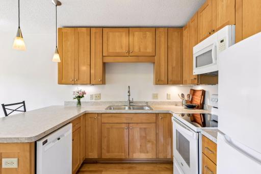 Lots of storage in gorgeous custom cabinets