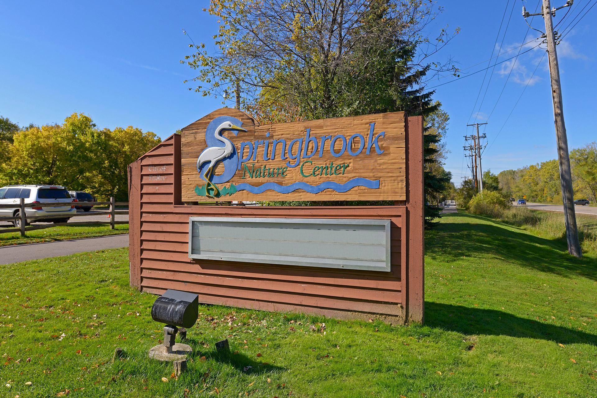 Springbrook Nature Center, a 127-acre park and nature reserve with over three miles of hiking trails through wooded and wetland areas, and public shelters