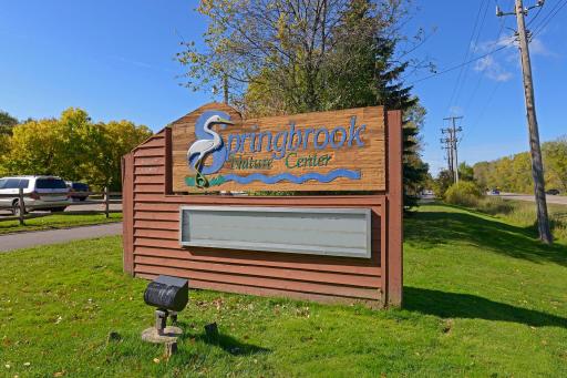 Springbrook Nature Center, a 127-acre park and nature reserve with over three miles of hiking trails through wooded and wetland areas, and public shelters