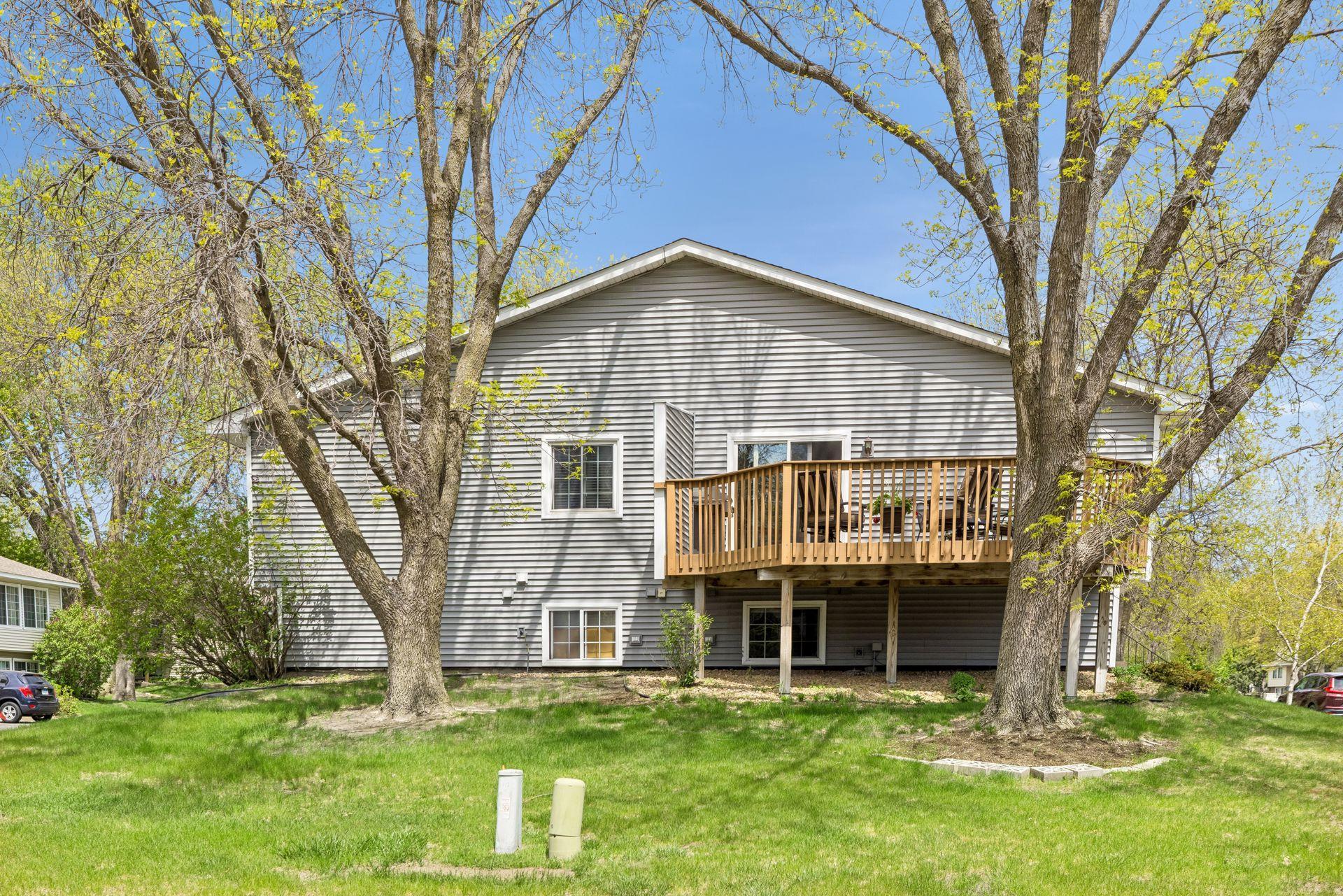 Oversized deck and large yard with mature trees