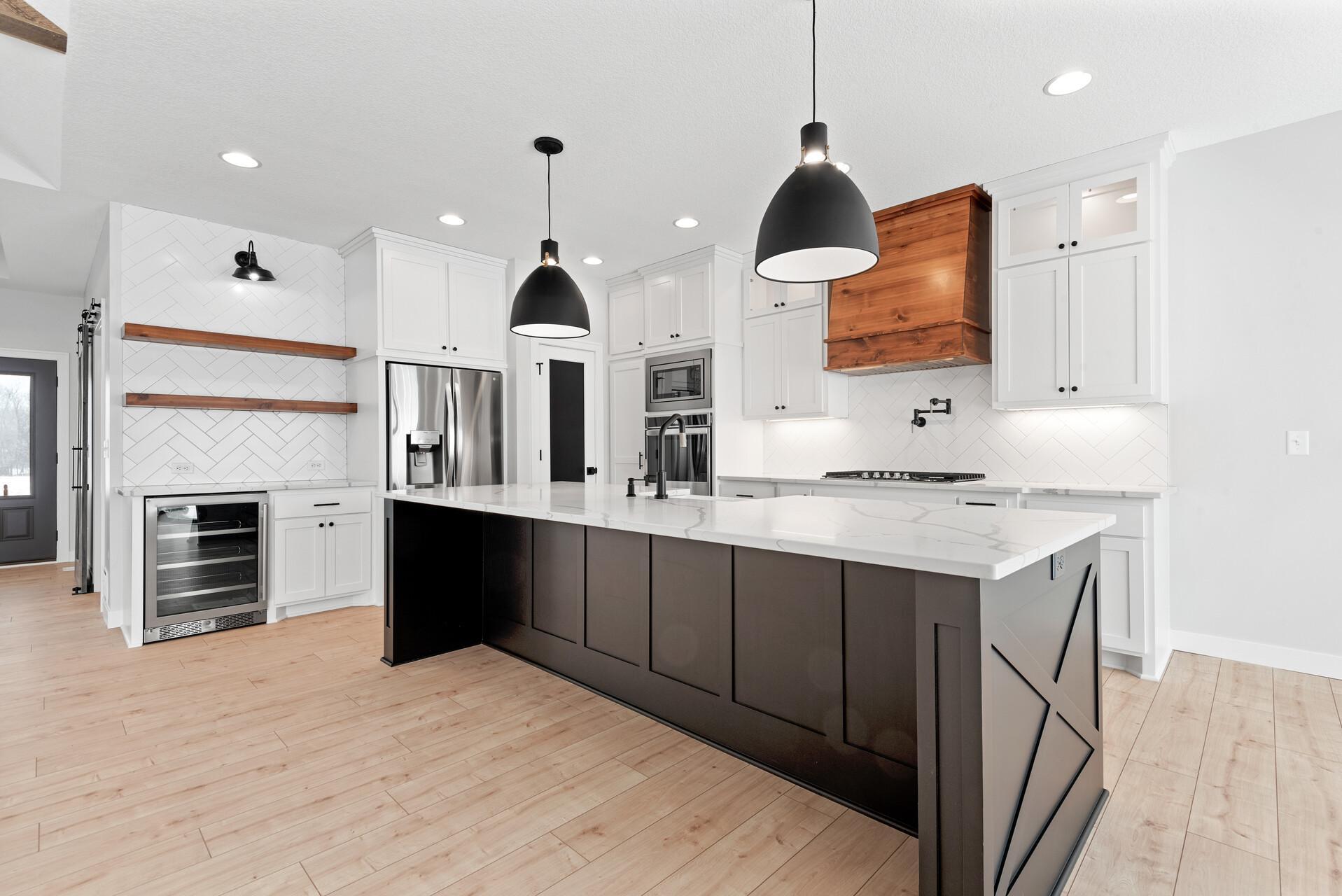 Gather around the Bold, Oversized Island! Photo of previous home.