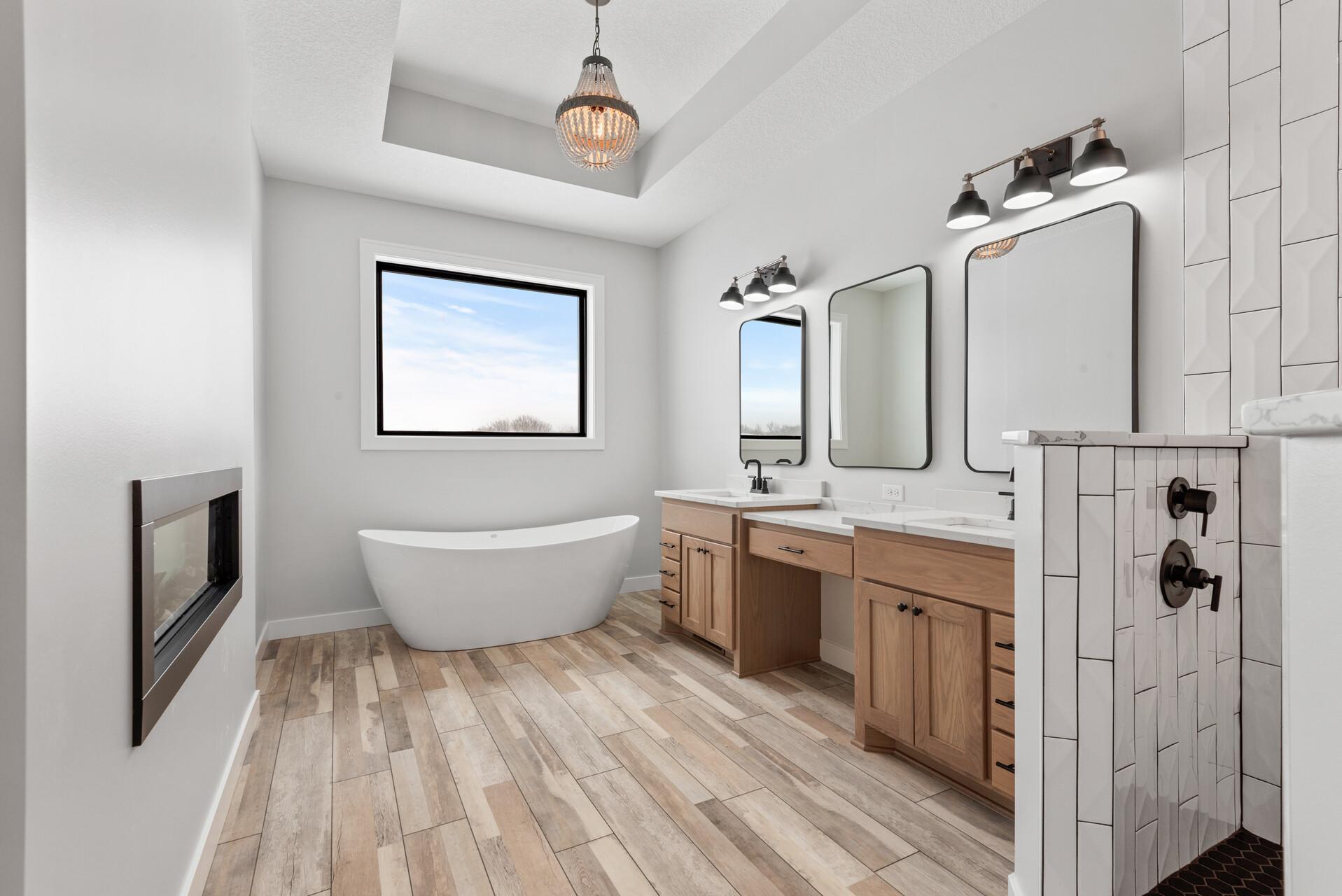 Primary Bath features: Vault, Chandelier, Standalone Tub, Dual Vanities, Make-Up Counter, Tile Walk-In Shower. Photo of previous home.