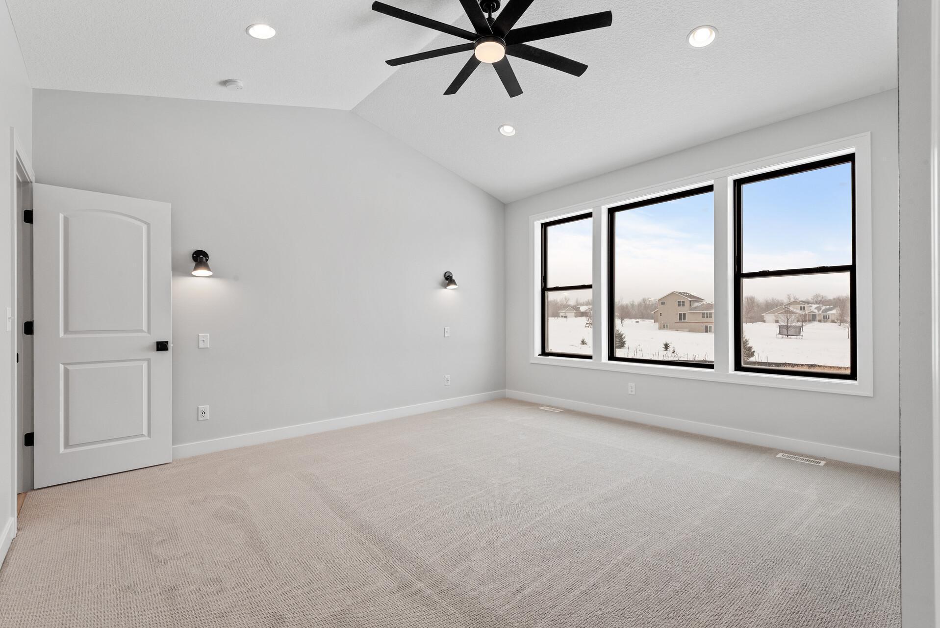 Generously sized Primary BR w/ Wall-Mounted Nightlights and a View of the Treed Lot!Photo of previous home.