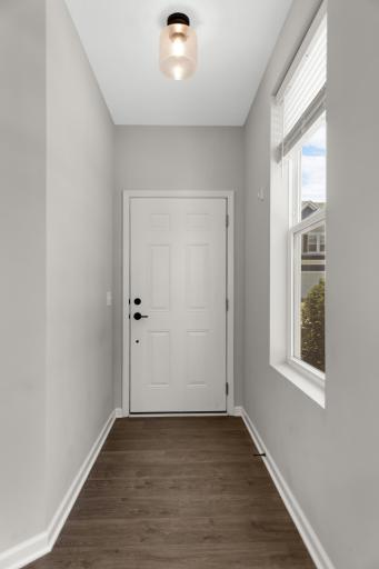 Sunny front entrance for this end unit.