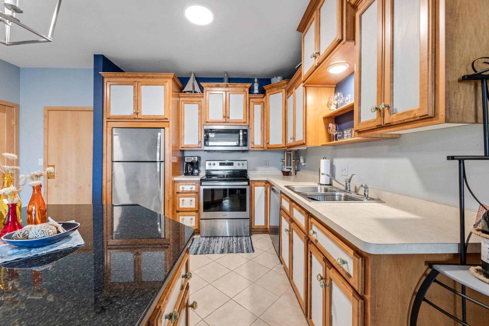 kitchen stainless steel appliances and granite island top