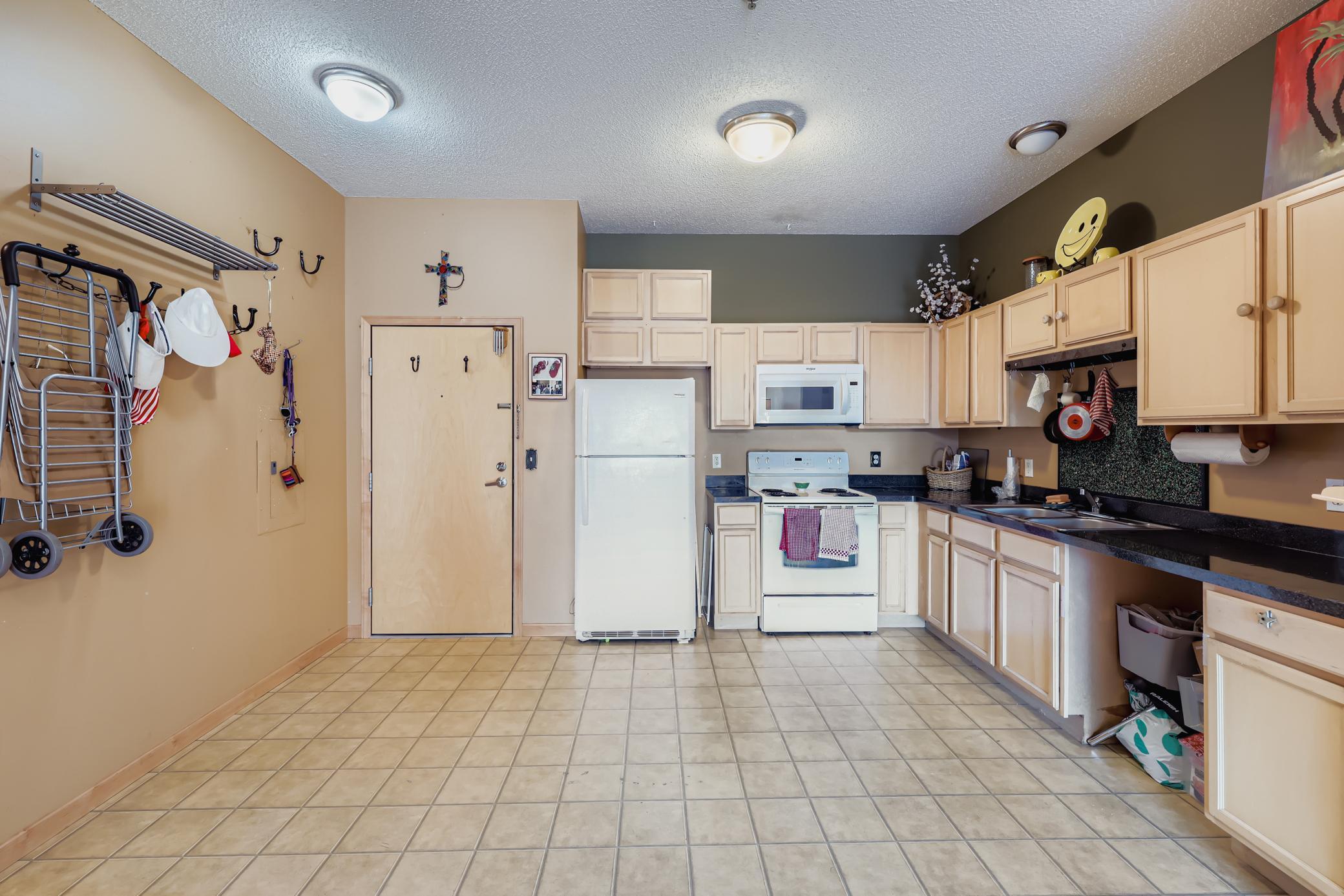 Kitchen has fridge, range microwave, nice cabinets and listing agent will install a dishwasher before closing. Currnet owner did not like having onef.jpg