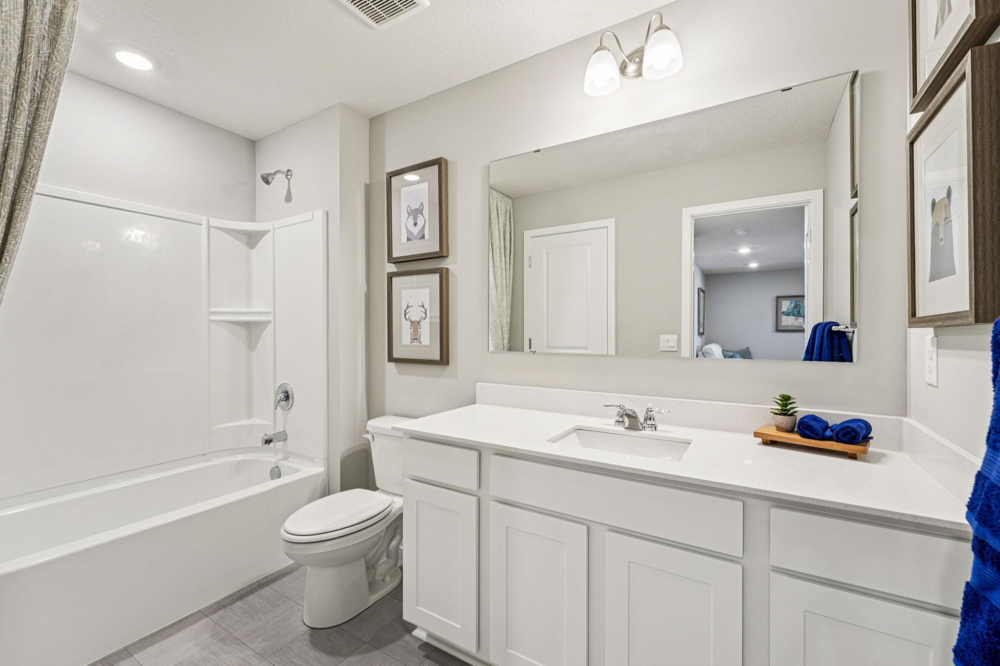 Another view of the guest bath. Photo of model home, color & options will vary.