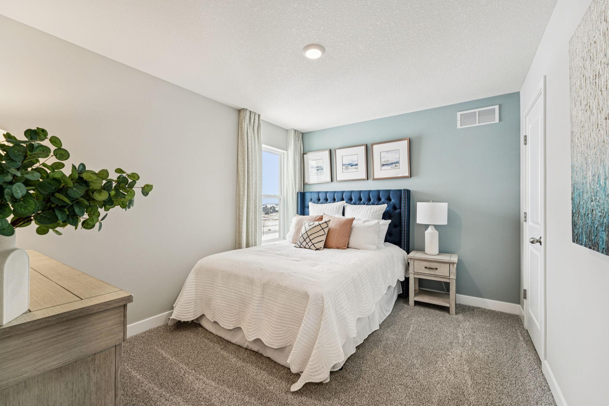 All four bedrooms upstairs are spacious and bright! Photo of model home, color & options will vary.
