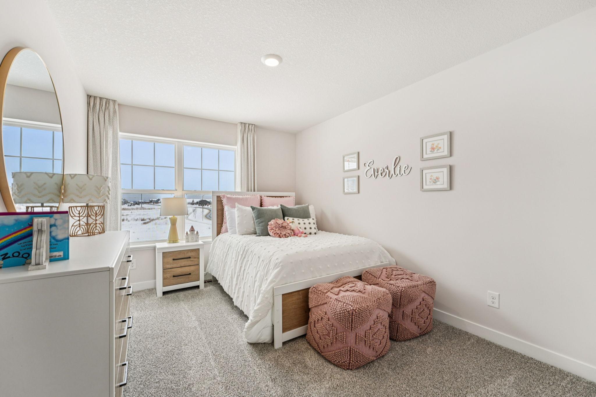 All four bedrooms upstairs are spacious and bright! Photo of model home, color & options will vary.
