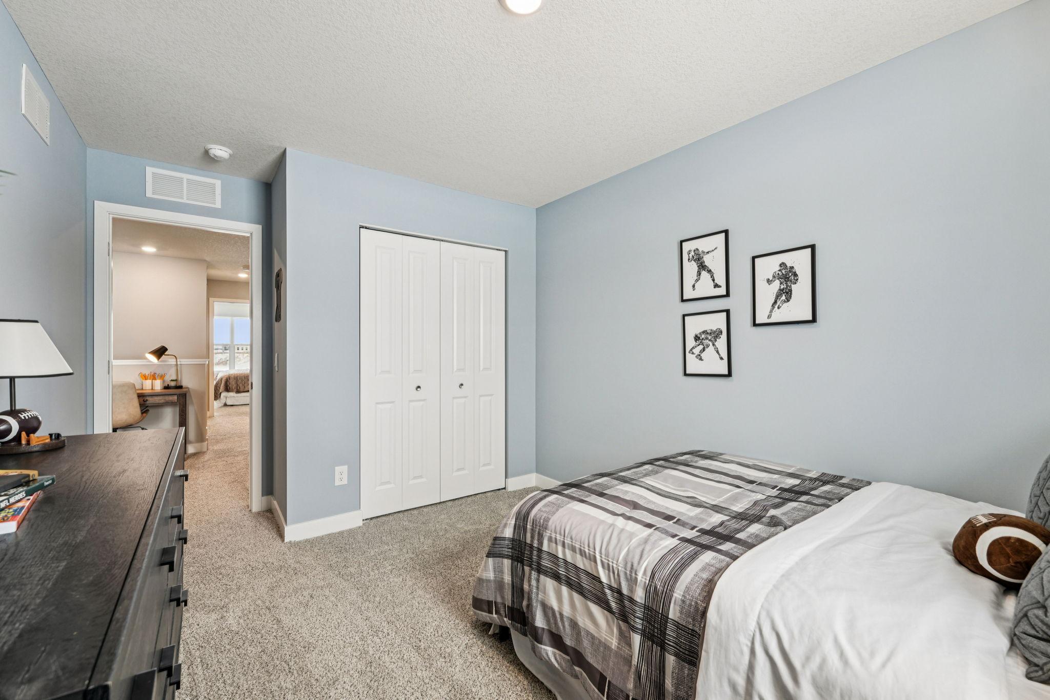 All four bedrooms upstairs are spacious and bright! Photo of model home, color & options will vary.