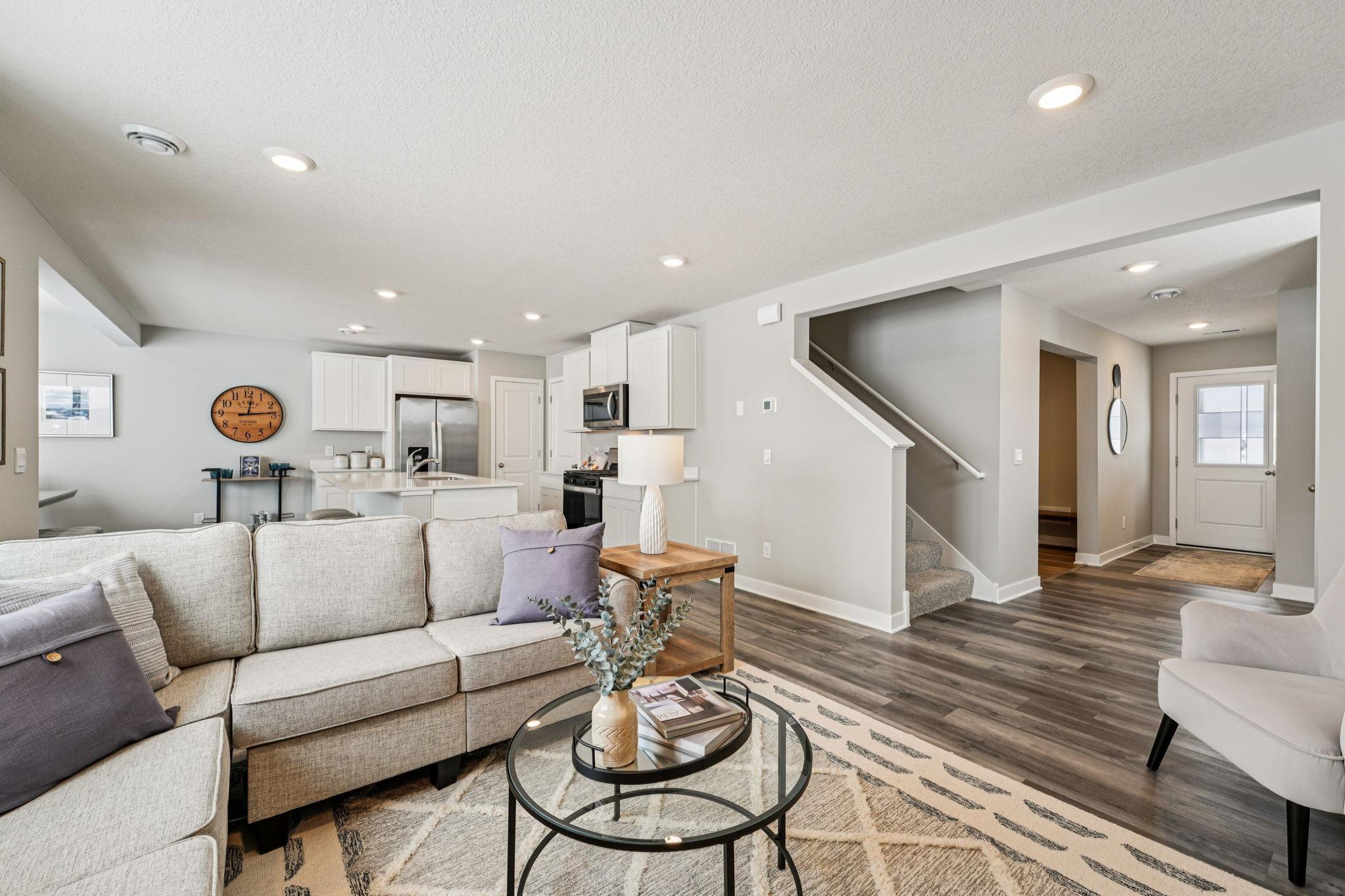 With the kitchen flowing into the living room, it makes for a great gathering space for family & friends. Photo of model home, color & options will vary.