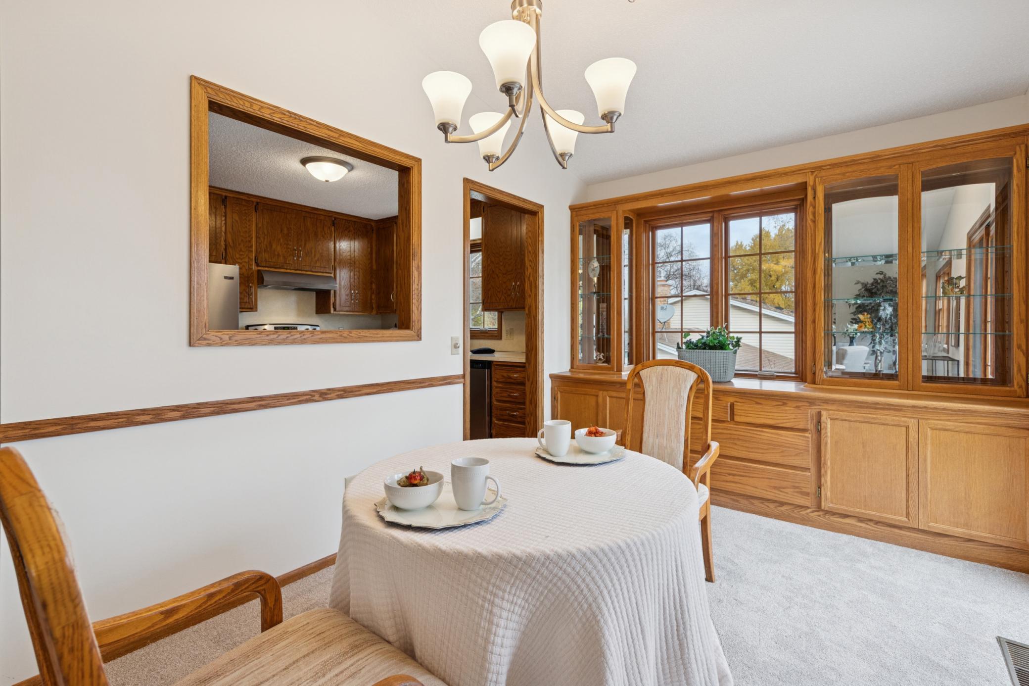 7. Dining has large pass thru to kitchen for open flow feel.jpg