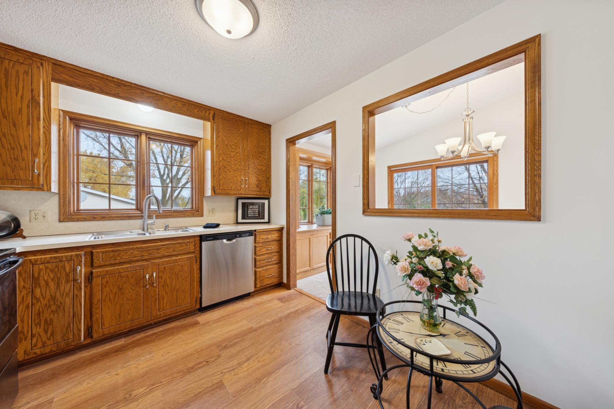 8. Kitchen pass thru to dining brings in nice light + sitting area.jpg
