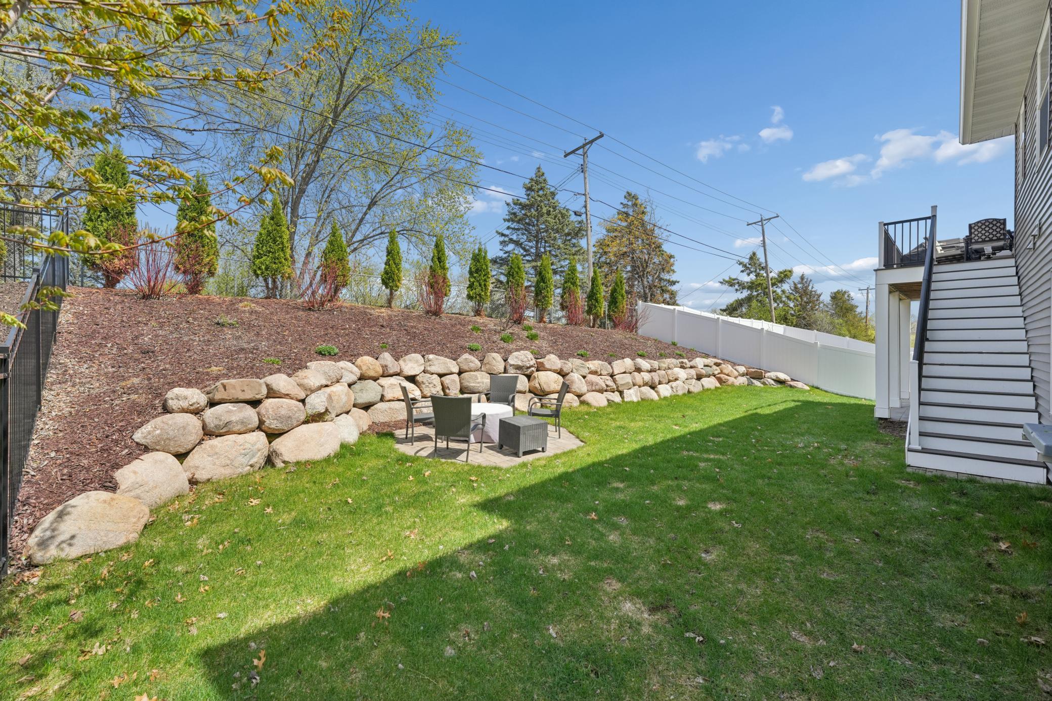 Professionally landscaped boulder wall