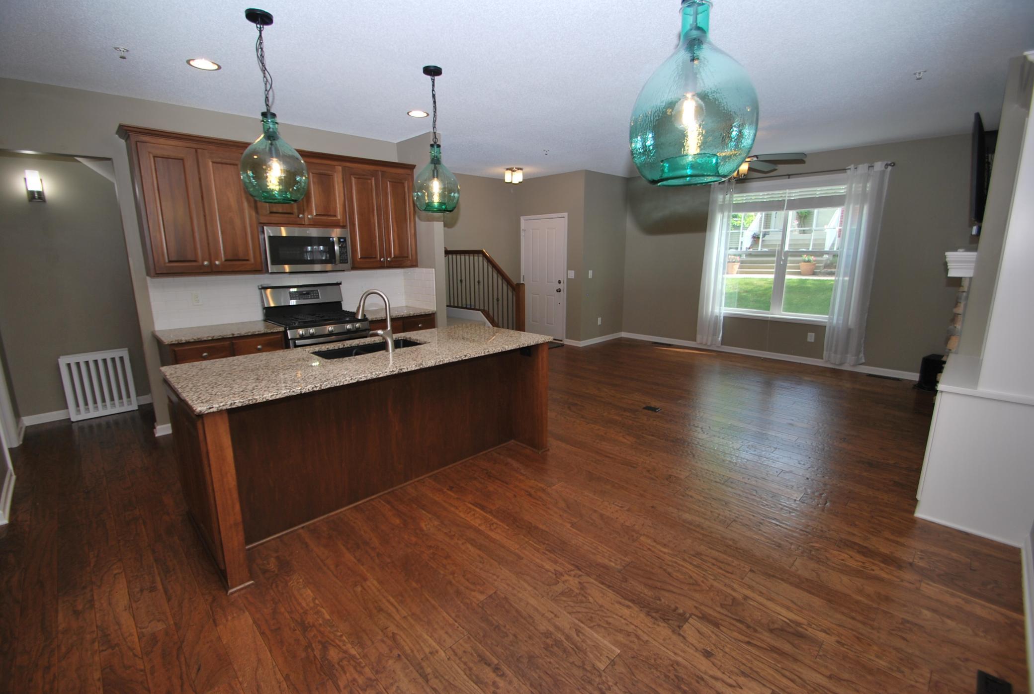 A view towards the front door and large living room space