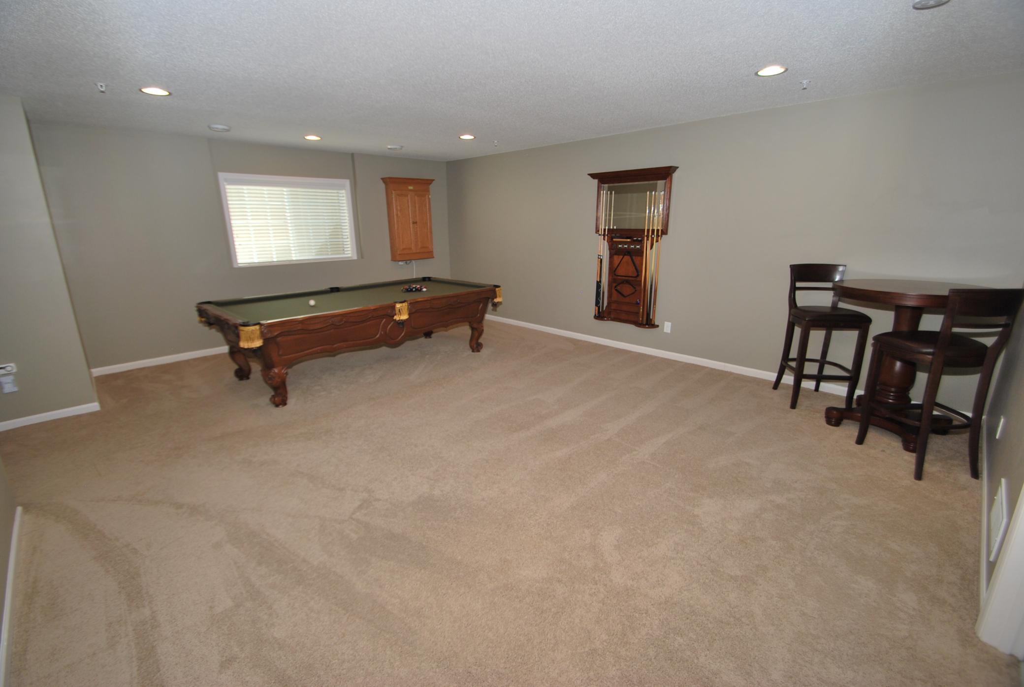 Lower level family room - pool table, dart board and accessories stay