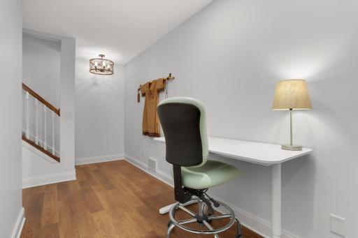Lower-level landing with flexible open workspace.