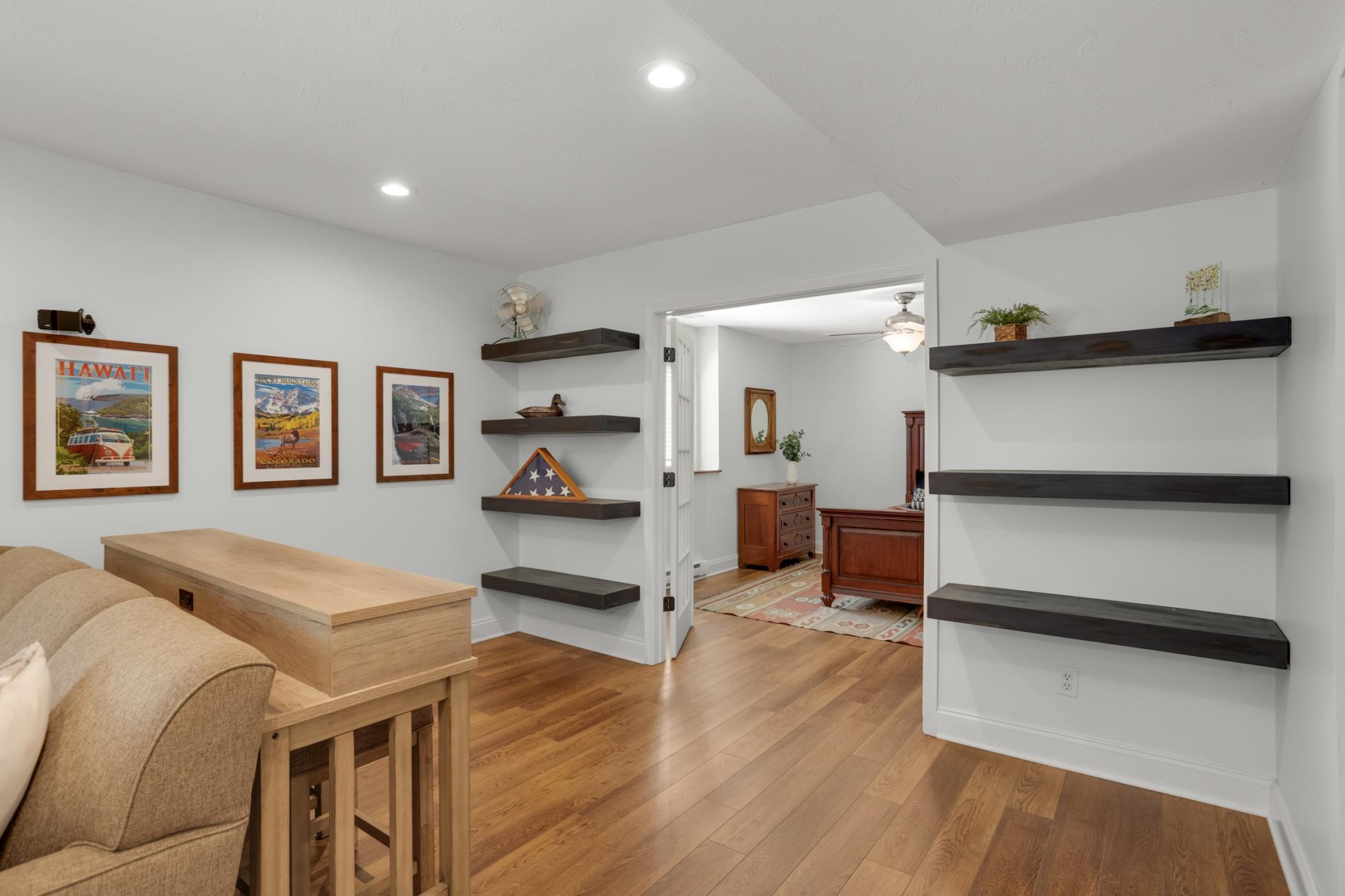 French doors lead to a private 4th lower-level bedroom.