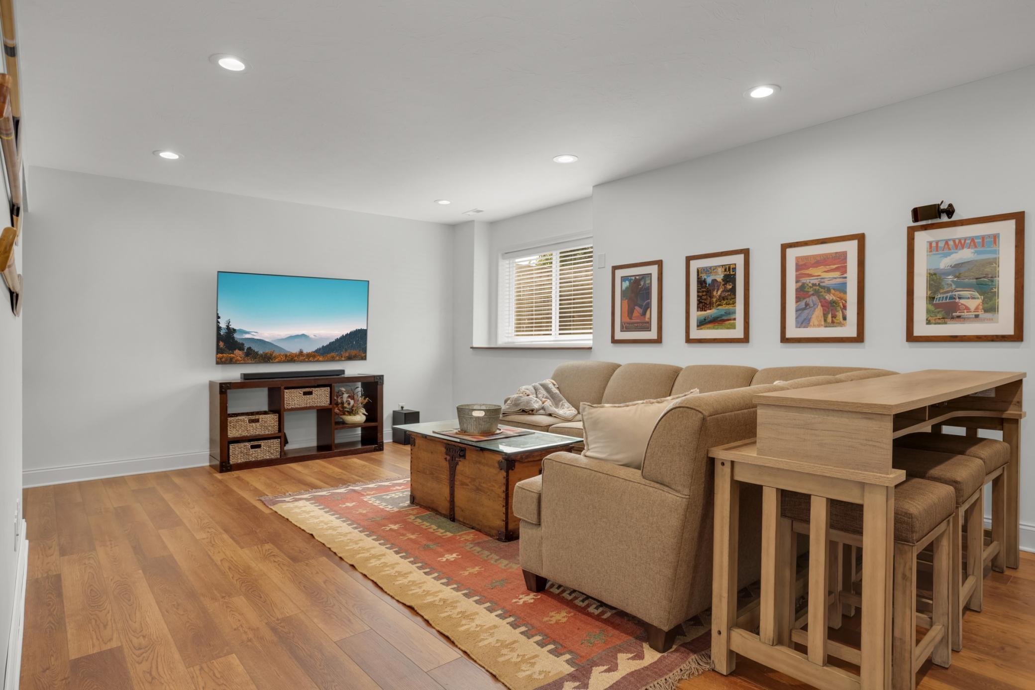 Lower-level family room made for movie & game nights with family and friends.