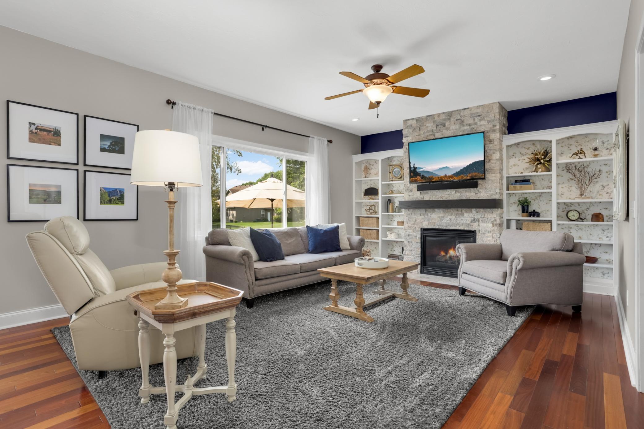 Light-filled living room with a cozy gas fireplace to enjoy year-round.