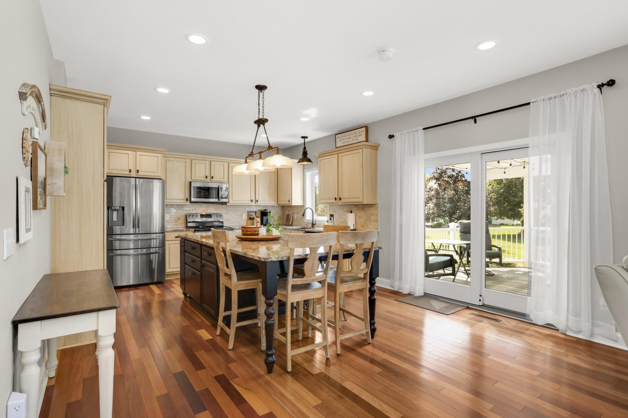 Eat-in kitchen with stunning Brazilian cherry floors (throughout main level) and easy access to the back deck.