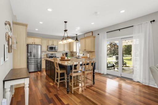 Eat-in kitchen with stunning Brazilian cherry floors (throughout main level) and easy access to the back deck.