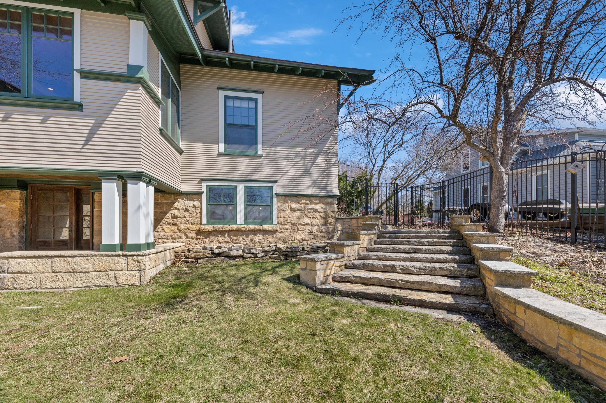 Charming original steps from the backyard to the home, adding character and a touch of history to the outdoor space.