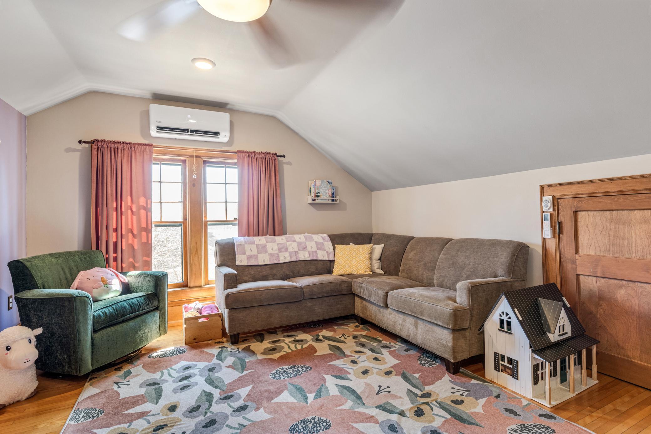 charming upper bedrooms with hardwood floors and paneled doors.