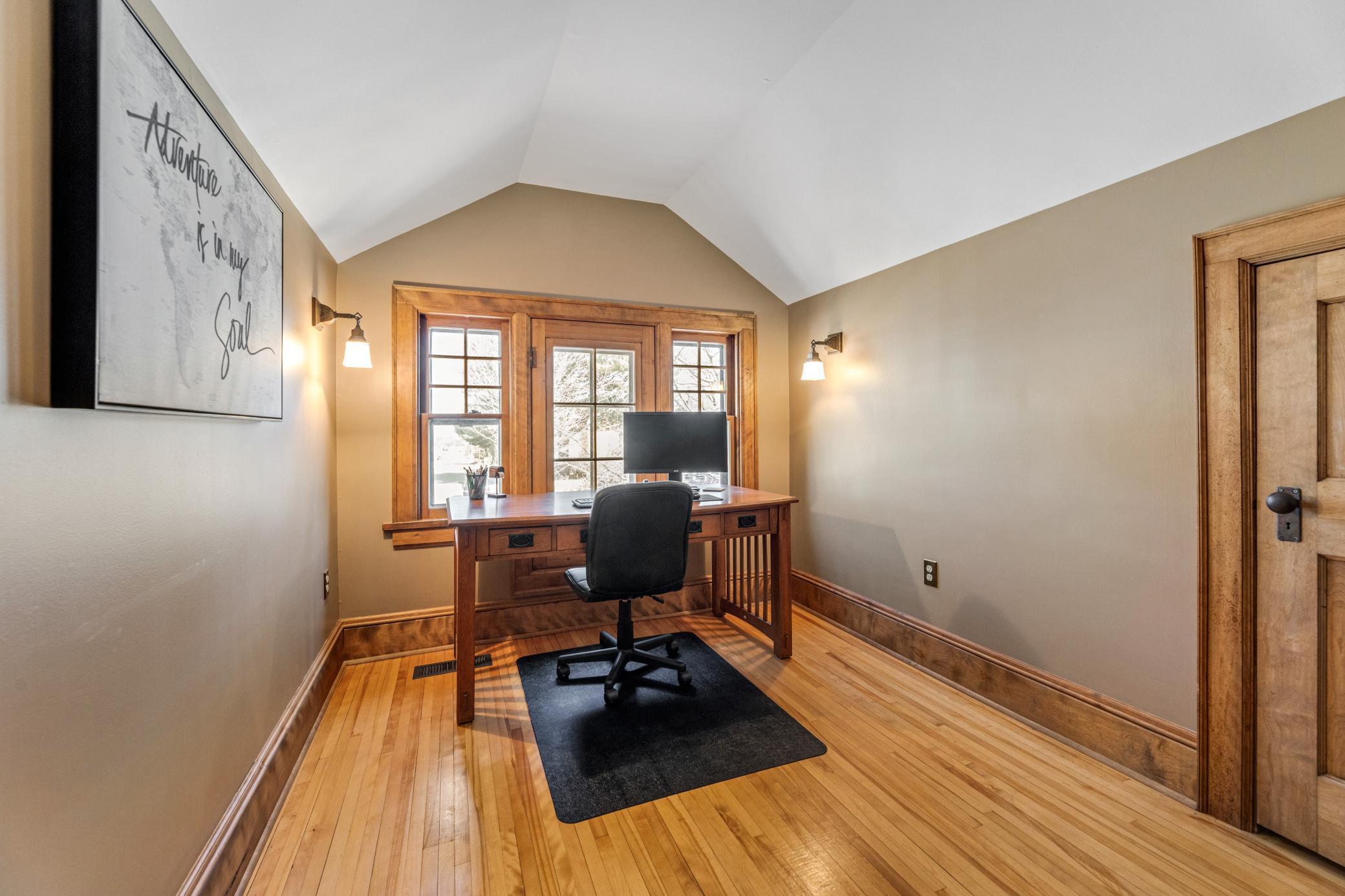 charming upper bedrooms with hardwood floors and paneled doors.