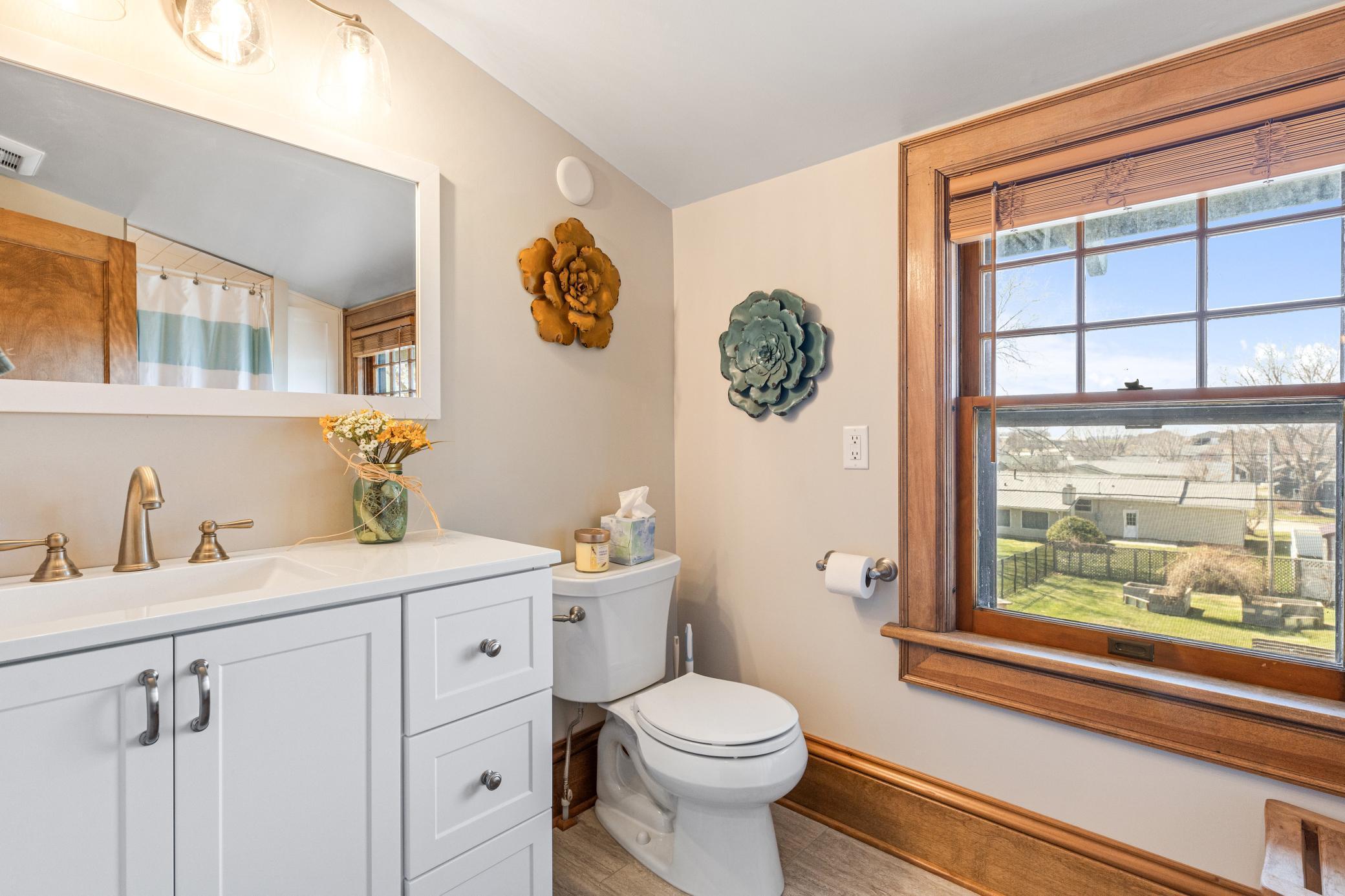 Convenient upper-level 3/4 bath thoughtfully positioned for easy access from all upstairs bedrooms.