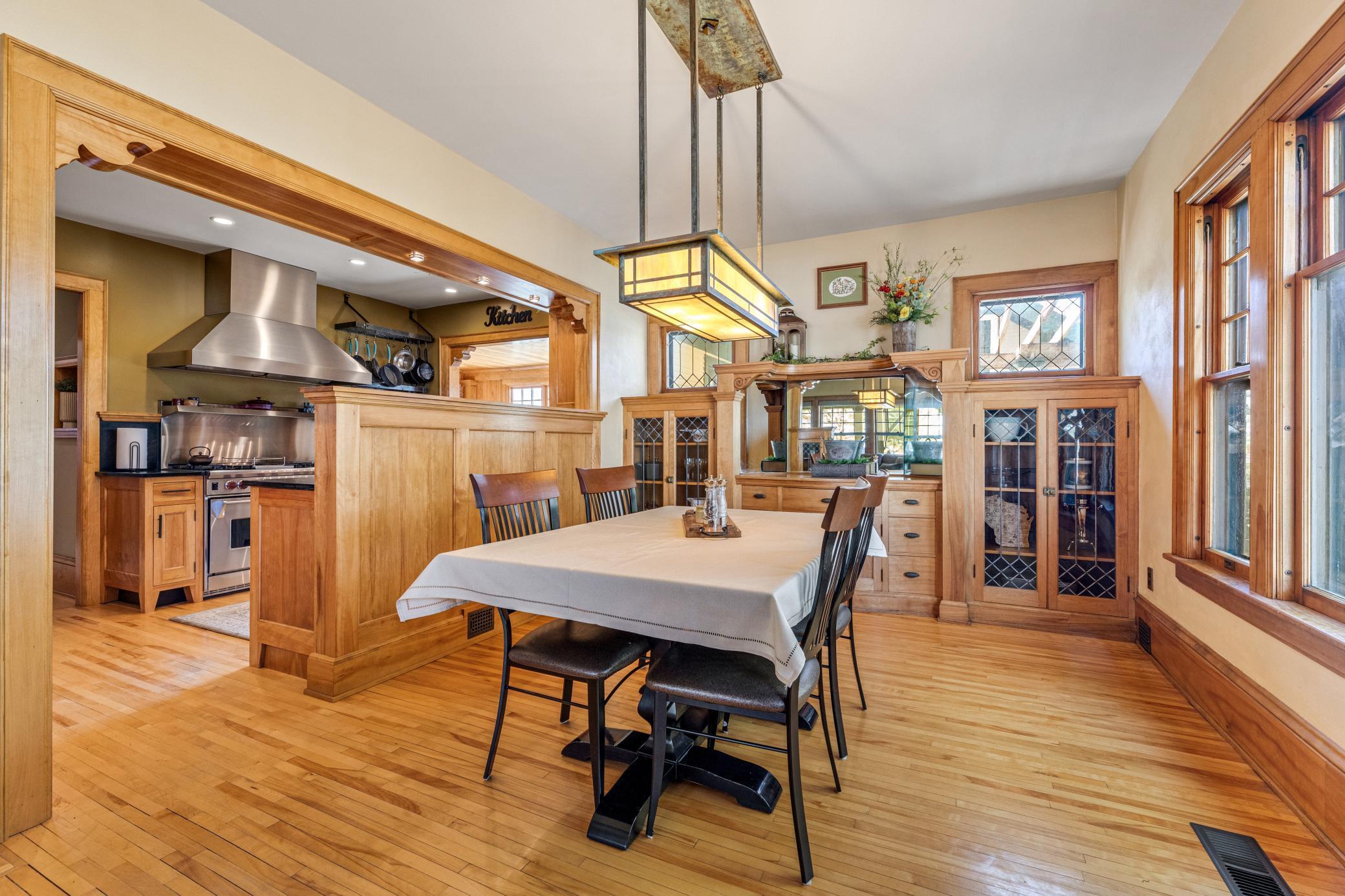 Elegant formal dining framed by leaded glass and rich built-ins that set the stage for unforgettable gatherings