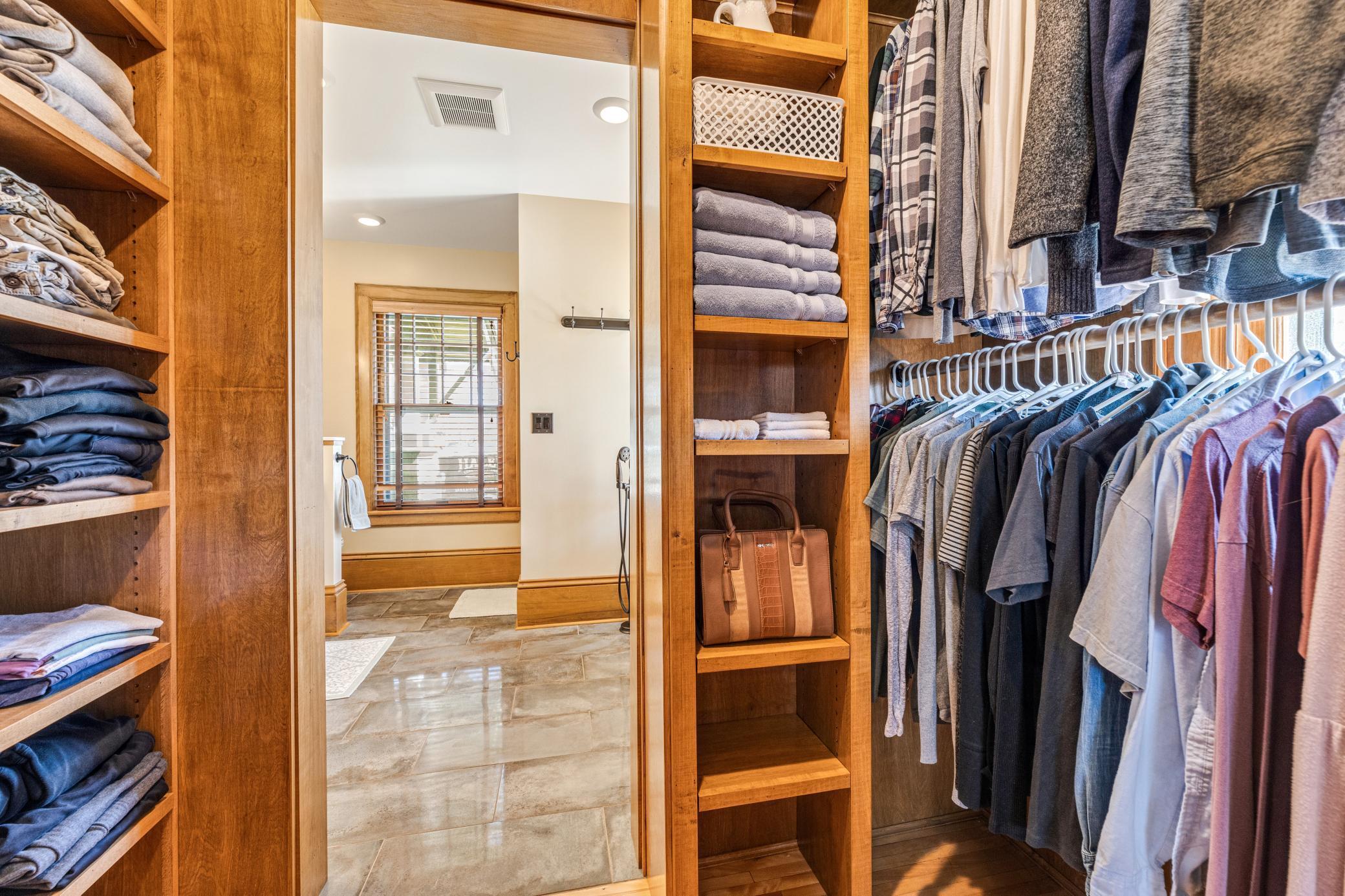 Spacious walk-in closet offering effortless organization with room to keep everything beautifully in its place.