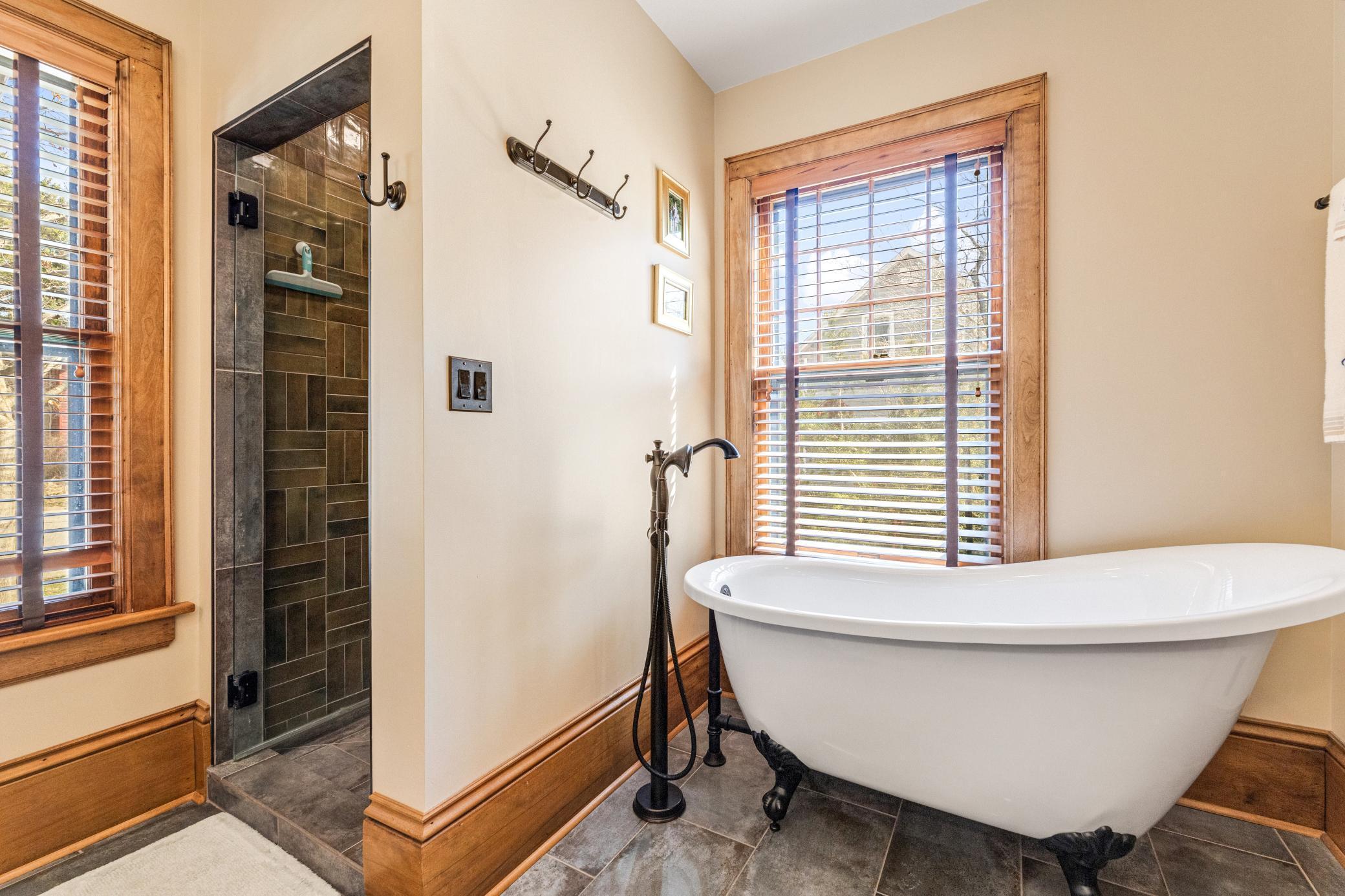 spa-like bath featuring a soaking tub and walk-in shower