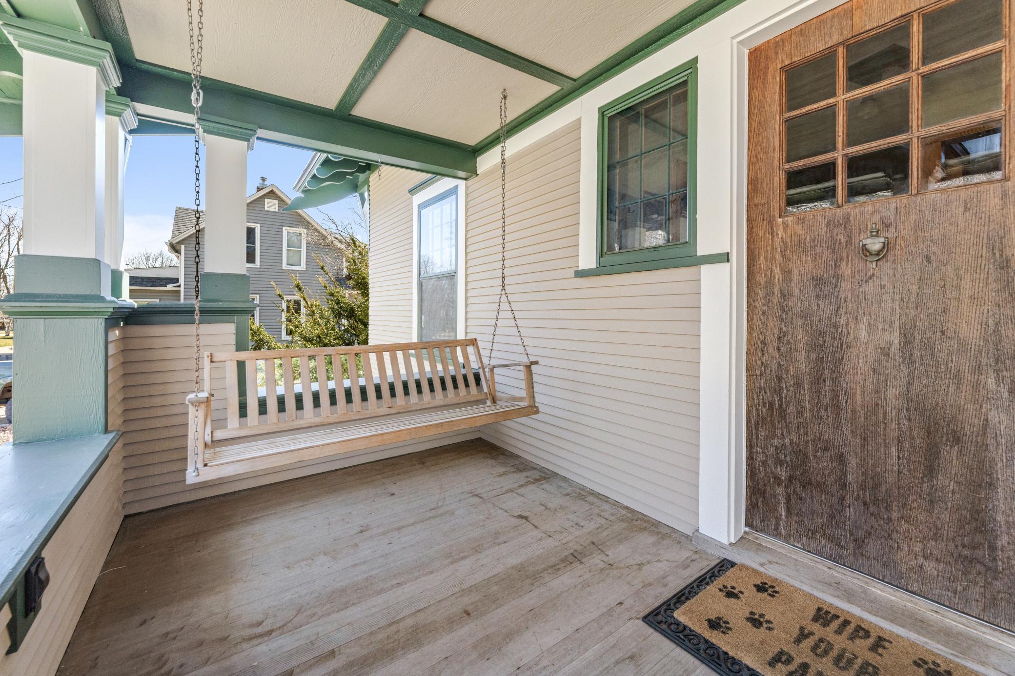 Classic front porch swing perfect for slow mornings, evening unwinding, and everything.