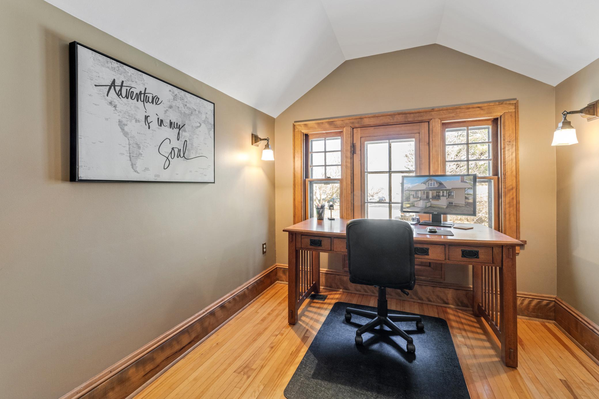 charming upper bedrooms with hardwood floors and paneled doors.
