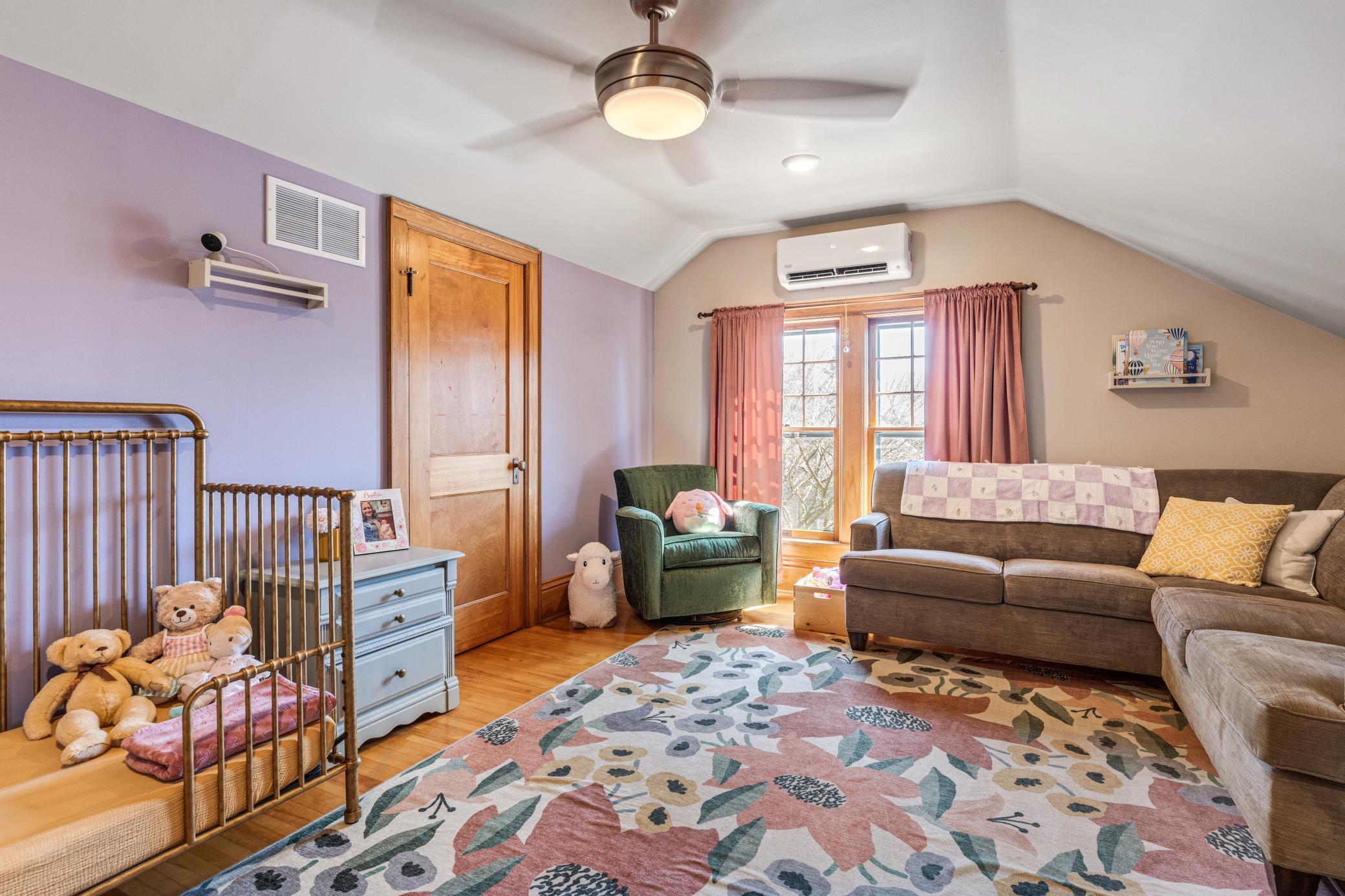 charming upper bedrooms with hardwood floors and paneled doors.