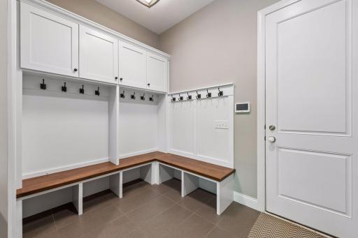 Just off the garage is a spacious mudroom with built-ins and a large walk-in closet
