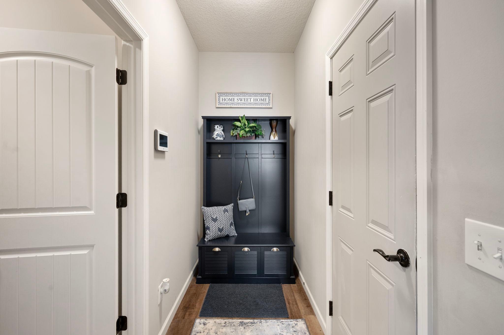 Hallway leading to Garage Entrance and Laundry Room/Utility Room