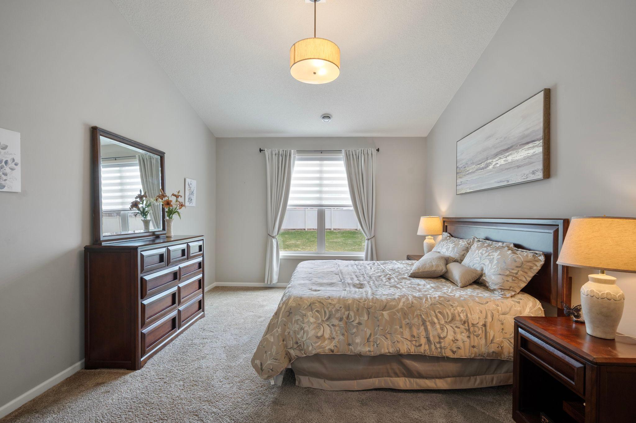 Primary Bedroom - Window overlooks Backyard