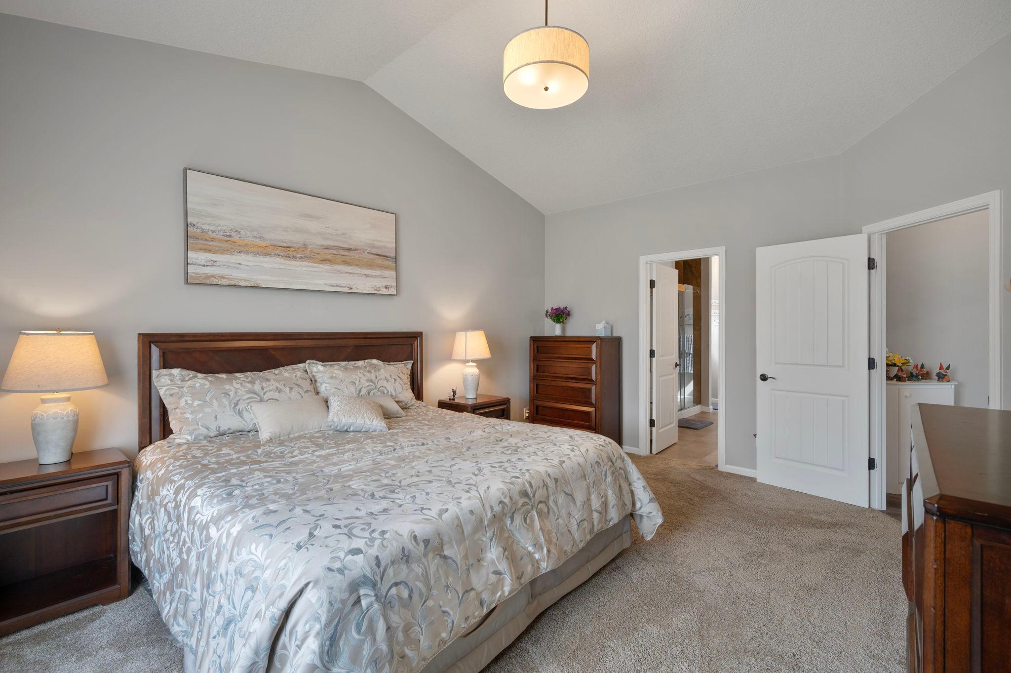 Primary Bedroom - View #2 - Door on the right opens to small hallway leading to the Great Room, door on the left leads to Primary Bathroom