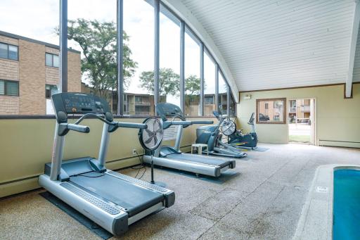 Exercise equipment adjacent to the indoor pool.