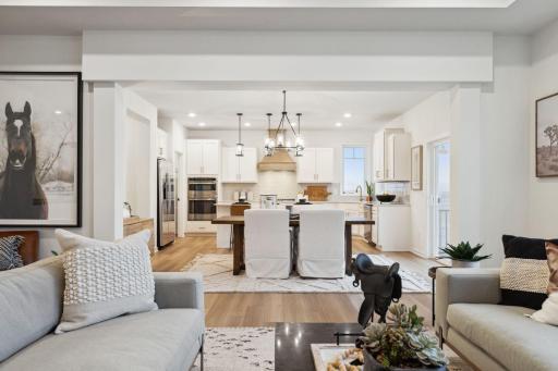 Living room with kitchen views - (Staged photo of a model) Pic for representational purposes as finishes may be different.
