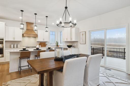 Informal dining in kitchen - (Staged photo of a model)Pic for representational purposes as finishes may be different.