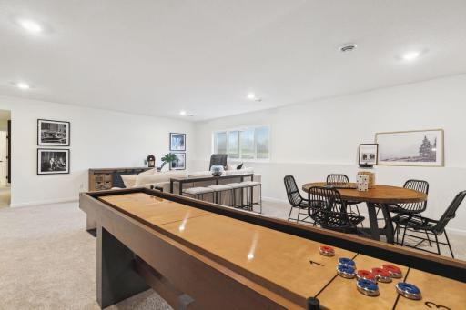 Lower level recreation room - (Staged pic of a model)Pic for representational purposes as finishes may be different.