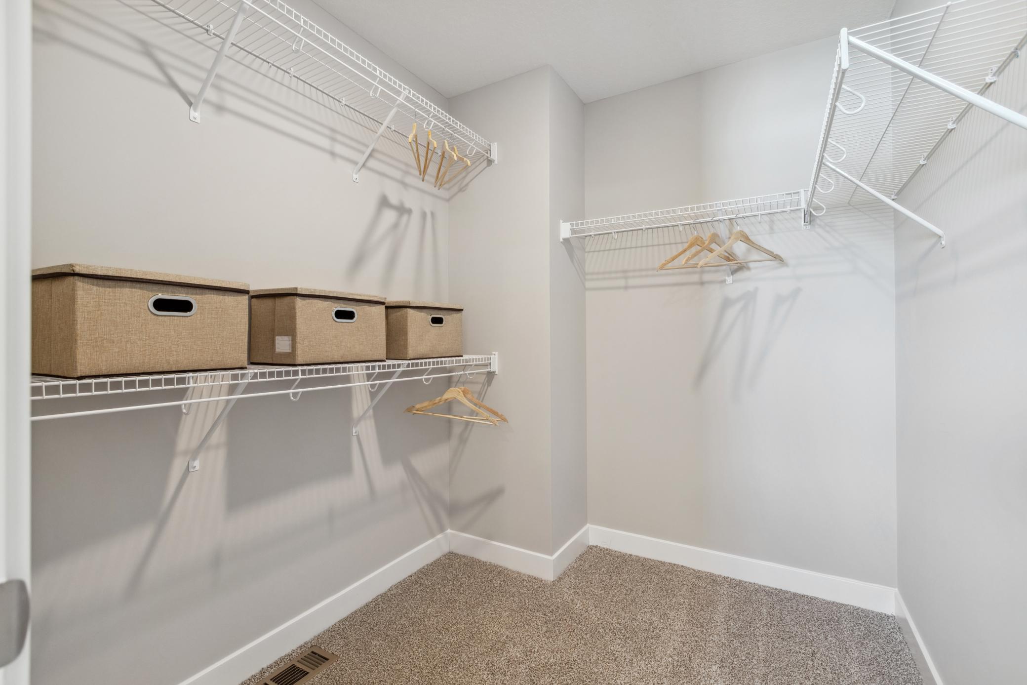 Primary suite has two walk in closets.
