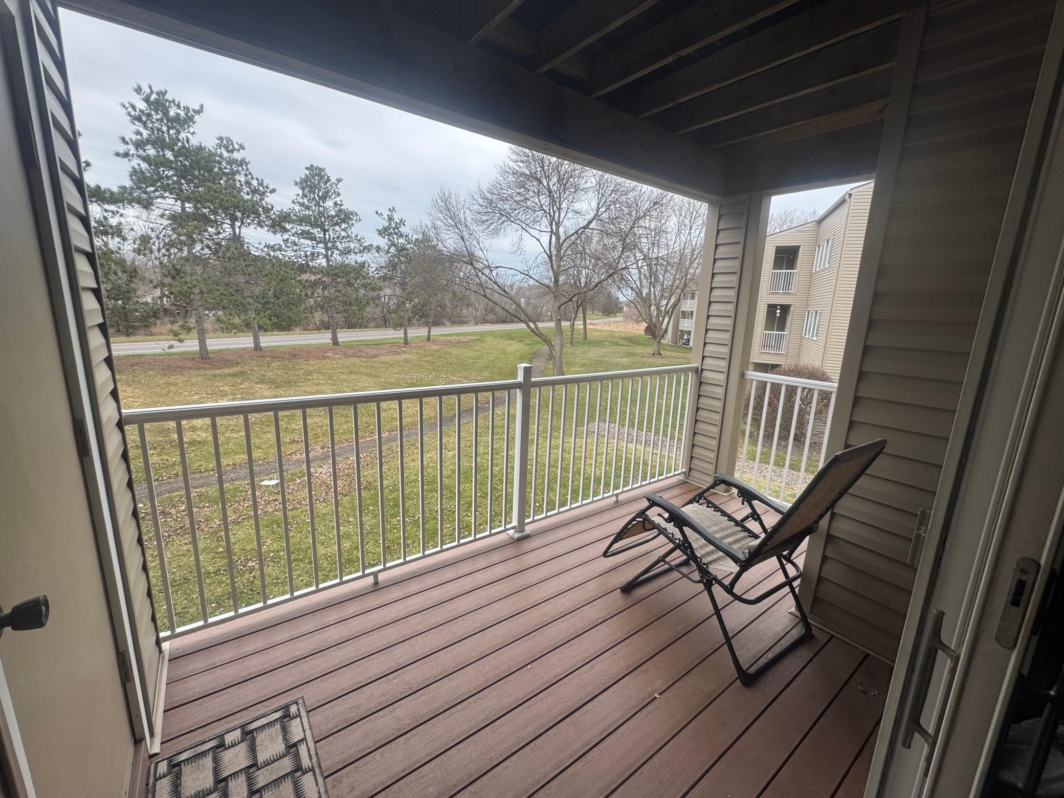 Nice relaxing balcony looking out to the backyard and trail.