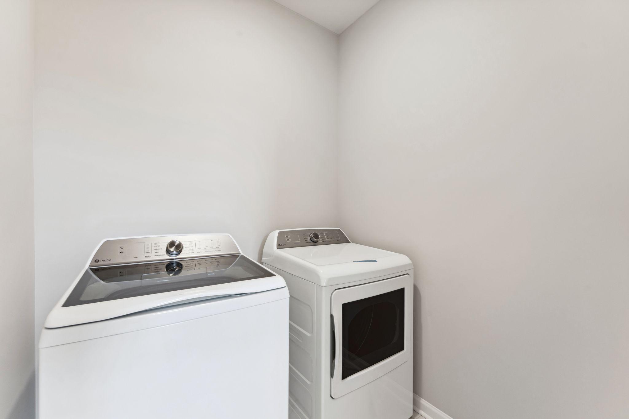 Convenient main level laundry includes the washer & dryer. Similar home shown, color & finish can vary.