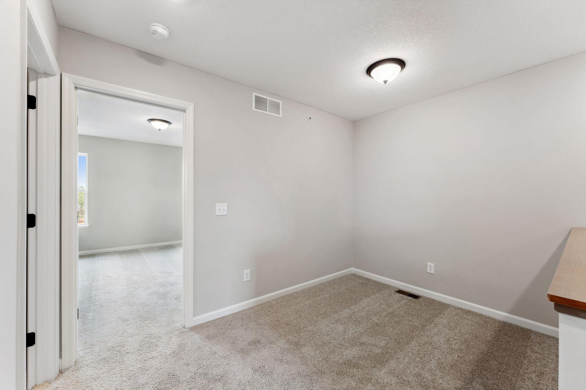 Upper level loft separates the bedrooms for that added privacy. Similar home shown, color & finish can vary.