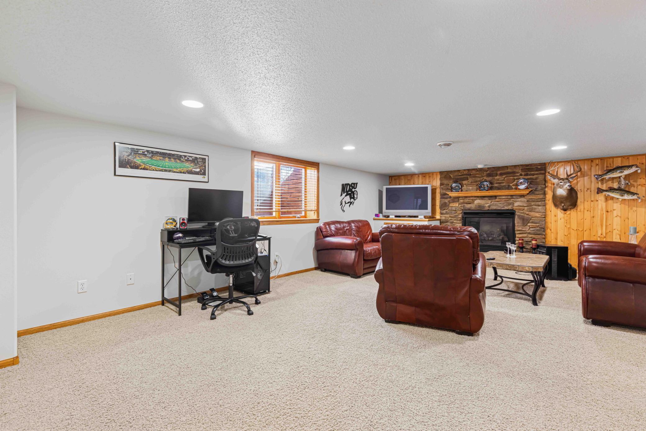 Lower-level family room with cozy gas fireplace - 23.2' x15.10'